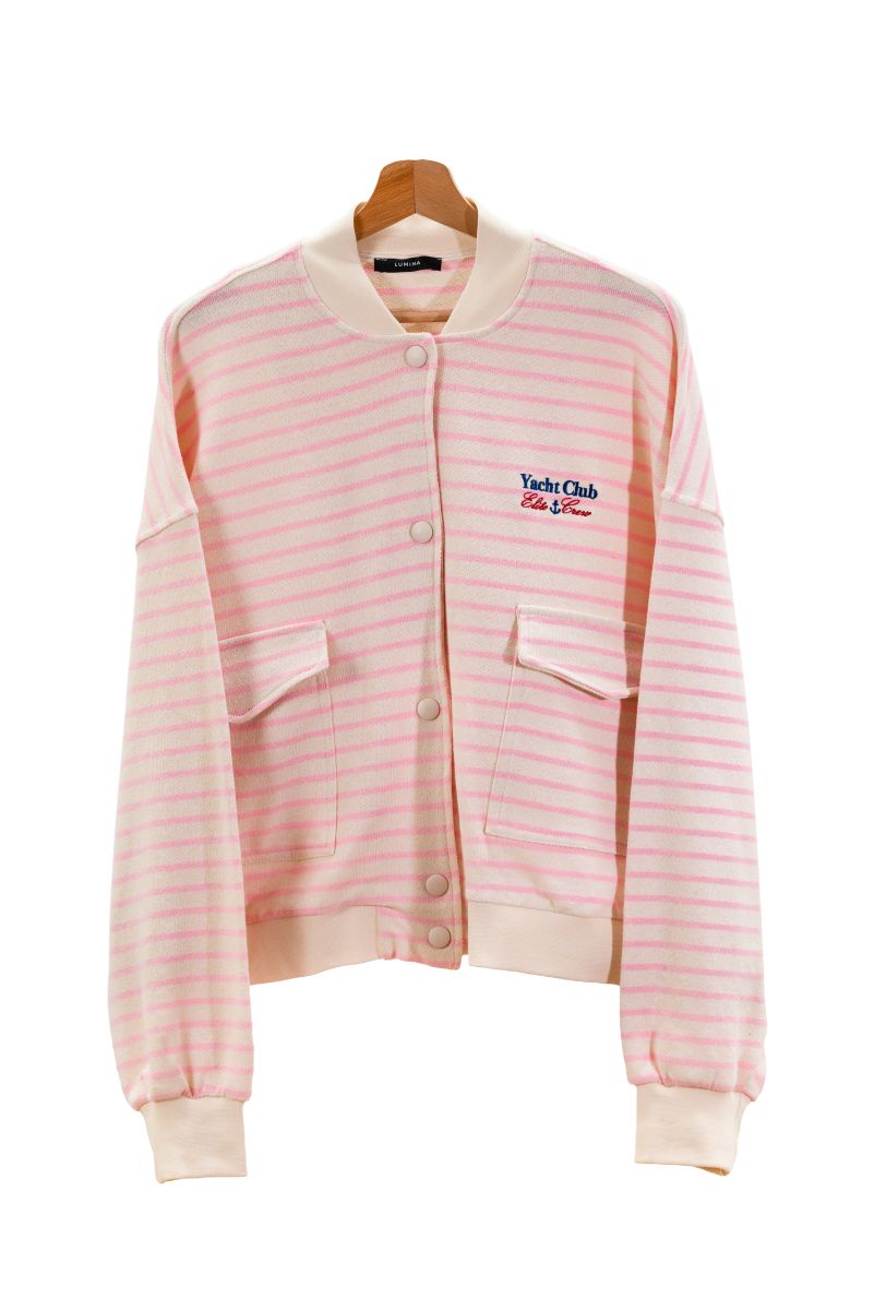 Pink and white striped jacket with a logo on a hanger against a white background